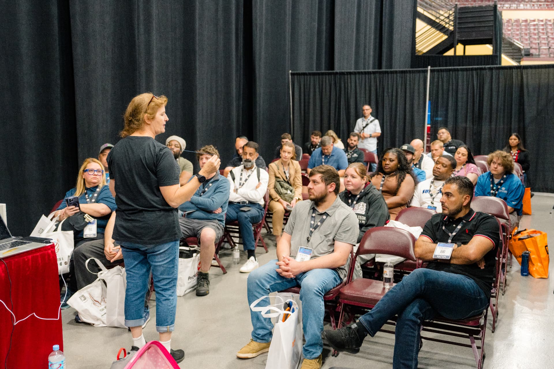 Packed training session at GRE with attendees watching a presenter